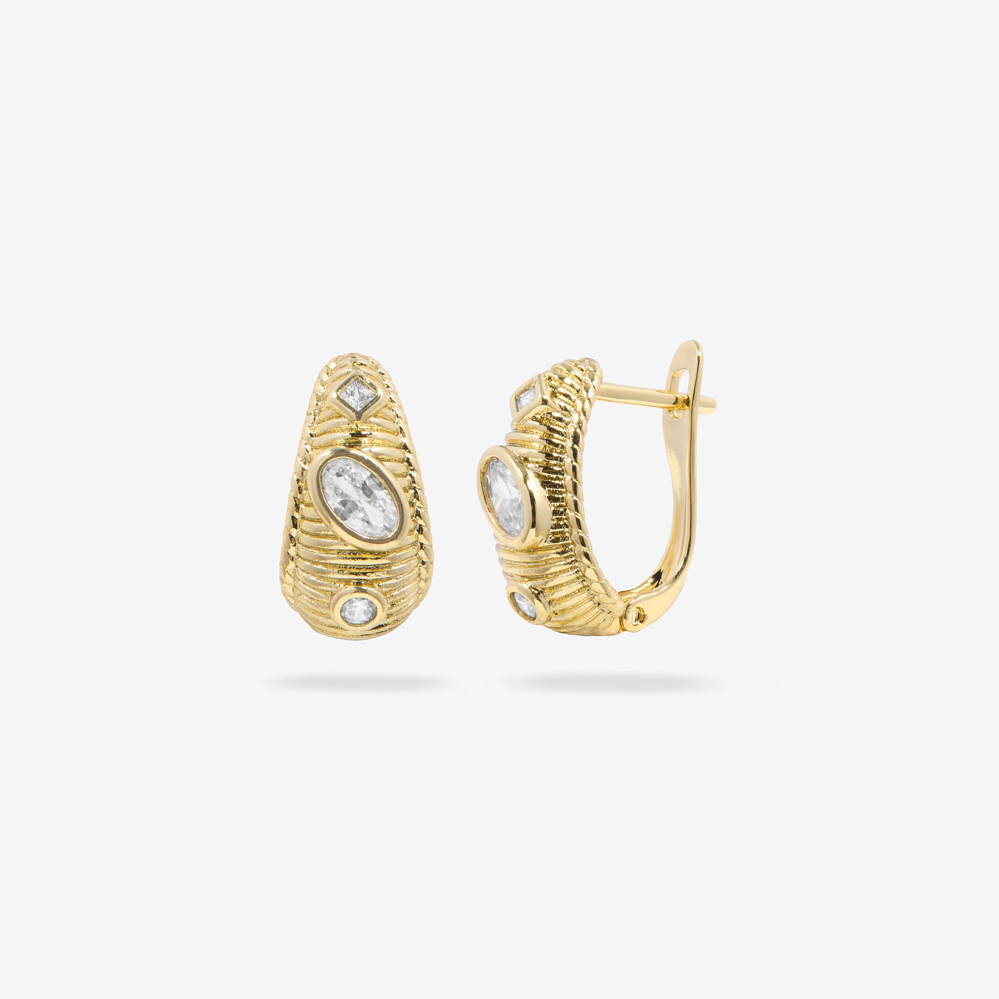 Gold hoop earrings with diamond accents on a white background